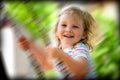 Happy child on swing Royalty Free Stock Photo