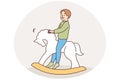 Happy child swinging on rocking horse Royalty Free Stock Photo