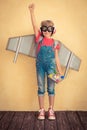 Happy child with toy jetpack playing at home Royalty Free Stock Photo