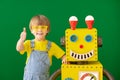 Happy child with toy robot in class Royalty Free Stock Photo