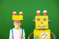 Happy child with toy robot in class Royalty Free Stock Photo