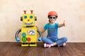 Happy child with toy robot Royalty Free Stock Photo