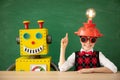 Happy child with toy robot in school Royalty Free Stock Photo