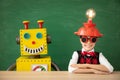 Happy child with toy robot in school Royalty Free Stock Photo