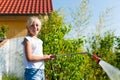 Happy child watering flowers Royalty Free Stock Photo