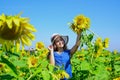 happy childhood. beautiful girl wear straw summer hat in field. pretty kid with flower. beauty of summer nature. little Royalty Free Stock Photo