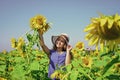 happy childhood. beautiful girl wear straw summer hat in field. pretty kid with flower. beauty of summer nature. little Royalty Free Stock Photo