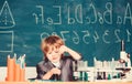 Happy childhood. Boy near microscope and test tubes school classroom. Knowledge concept. Knowledge day. Kid study