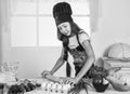 happy childhood. happy child wear cook uniform. chef girl in hat and apron. kid cooking food in kitchen. choosing a Royalty Free Stock Photo