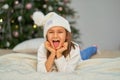 Happy childhood, Christmas magic fairy tale. Little girl waiting for Christmas and holiday gifts Royalty Free Stock Photo