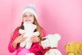 Happy childhood concept. Child small girl playful hold teddy bear plush toy. Why kids love stuffed animals. Toy every Royalty Free Stock Photo