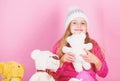 Happy childhood concept. Child small girl playful hold teddy bear plush toy. Why kids love stuffed animals. Toy every Royalty Free Stock Photo