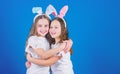 Happy childhood. Friendship concept. Easter vibes. Happy easter. Holiday bunny girls with long bunny ears hug. Children Royalty Free Stock Photo