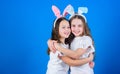 Happy childhood. Friendship concept. Easter vibes. Happy easter. Holiday bunny girls with long bunny ears hug. Children Royalty Free Stock Photo