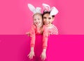 Happy childhood. Girls with bunny ears. Little sister kids celebrate easter. Egg hunt. Spring holiday.