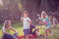 Happy Childhood-Happy family with children blow soap bubbles in park Royalty Free Stock Photo