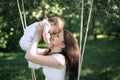 Happy childhood of a healthy child. Close-up baby in mother's arms. Mom pressed against the forehead of your baby.