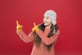Happy childhood. kid fashion. Warm knitting tips. small child ready for winter. happy little girl in earflap hat Royalty Free Stock Photo