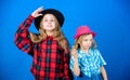 Happy childhood. Kids fashion concept. Check out our fashion style. Fashion trend. Girls kids wear fashionable hats Royalty Free Stock Photo