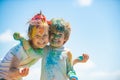 Happy childhood. Kids playing colours with smeared face. Holi festival of colors. Child girls and boy celebrate holi Royalty Free Stock Photo