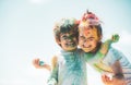 Happy childhood. Kids playing colours with smeared face. Holi festival of colors. Child girls and boy celebrate holi Royalty Free Stock Photo