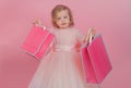 Happy childhood of little girl. Kid shopping. shopping bags. Christmas gift. Thanks for your purchase. big sale in