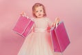 Happy childhood of little girl. Kid shopping. shopping bags. Christmas gift. Thanks for your purchase. big sale in