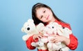 Happy childhood. Little girl play with soft toy teddy bear. Sweet childhood. Collecting toys hobby. Cherishing memories