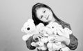 Happy childhood. Little girl play with soft toy teddy bear. Sweet childhood. Collecting toys hobby. Cherishing memories