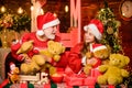 Happy childhood. Lovely present. Child enjoy christmas with grandfather Santa claus. Happiness and joy. Present surprise