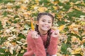 Happy childhood. School time. Happy little girl in autumn forest. Autumn leaves and nature. Small child with autumn