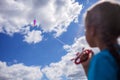 Happy childhood and summertime. Kid having fun and playing with a kite, outdoor Royalty Free Stock Photo