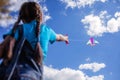 Happy childhood and summertime. Kid having fun and playing with a kite, outdoor Royalty Free Stock Photo