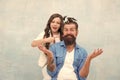 Happy childhood. Upbringing happy daughter. Family leisure concept. Girl dad hairdo. Daughter playing with hair Royalty Free Stock Photo