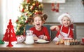 Happy children bake christmas cookies Royalty Free Stock Photo