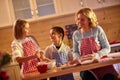 Happy children baking cookies with mother at home Royalty Free Stock Photo