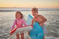 Happy children, beach and learning to surf for fun and bonding on bali summer vacation. Kids, boy and girl siblings on Royalty Free Stock Photo