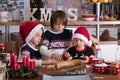 Happy children, boy brothers, baking christmas cookies at home Royalty Free Stock Photo