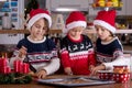 Happy children, boy brothers, baking christmas cookies at home Royalty Free Stock Photo