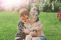 Happy children, boy and girl with face paint in park Royalty Free Stock Photo