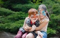 Happy children, boy and girl with face paint in park Royalty Free Stock Photo