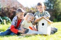 Happy children boys brothers tinkering together outdoors