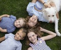 Happy children, boys and girls, lie on the grass in summer, top view Royalty Free Stock Photo