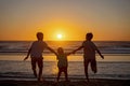 Happy children, boys, playing on the beach on sunset, kid cover in sand, smiling, laughing Royalty Free Stock Photo