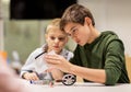 Happy children building robots at robotics school Royalty Free Stock Photo