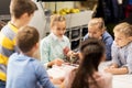 Happy children building robots at robotics school Royalty Free Stock Photo