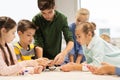 Happy children building robots at robotics school Royalty Free Stock Photo