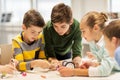 Happy children building robots at robotics school Royalty Free Stock Photo