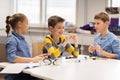 Happy children building robots at robotics school Royalty Free Stock Photo