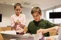 Happy children building robots at robotics school Royalty Free Stock Photo